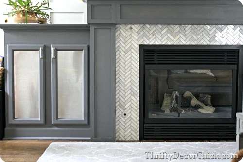 herringbone tile fireplace surround