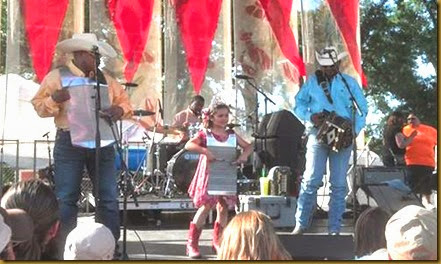 crawfish festival stage with little girl
