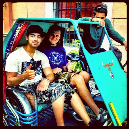 Joe Jonas and Brahms in pedicab at Fort Santiago