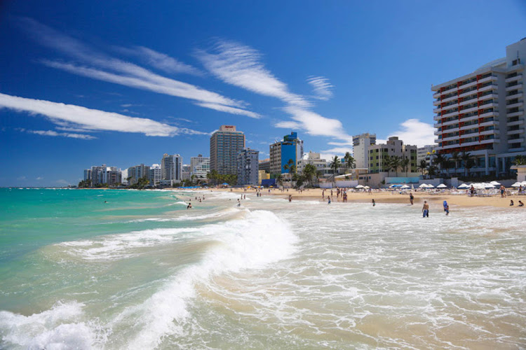 Hotels line the beachfront of Isla Verde Beach in Puerto Rico.