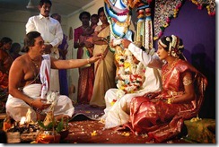 Brahman hindu priest bleses a young couple in the hindu temle of Chavakachcheri during traditional hindu wedding on 20. November 2005, Chavakachcheri, Jaffna Sri Lanka