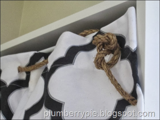 rope and shower curtain as hidden toy storage - plumberry pie