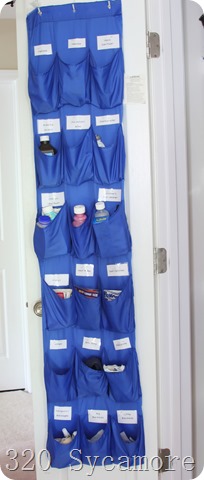 shoe organizer on back of linen closet for medicine storage