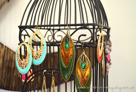 use a birdcage to hang earrings