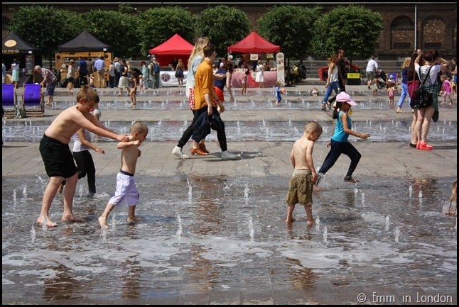 Playing in the fountains at Granary Square
