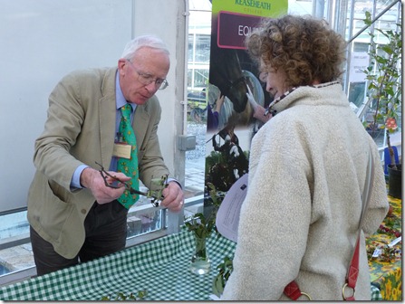Reaseheath lecturer Harry Delaney (left) offers fruit growing advice to a visitor