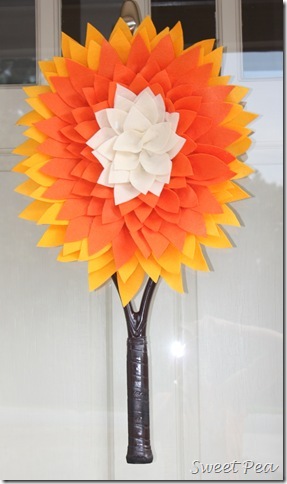 Tennis Racket Dahlia - Use an old or broken tennis racket to make a Tennis Racket Dahlia to hang on a wall or door.