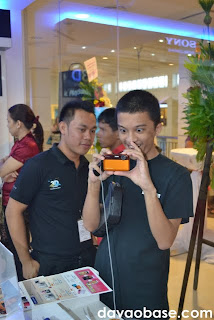 Mindanao Times writer Jesse Pizarro Boga in awe of the orange Sony Cybershot digital camera at Sony Centre in Abreeza Mall