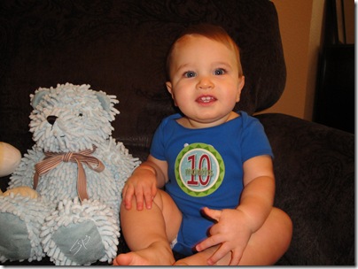 5.  Knox smiling with bear 10 months
