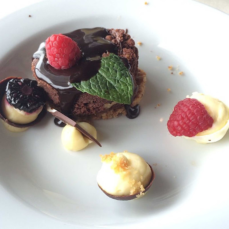 A chocolate dessert with berries served on Carnival Paradise. 