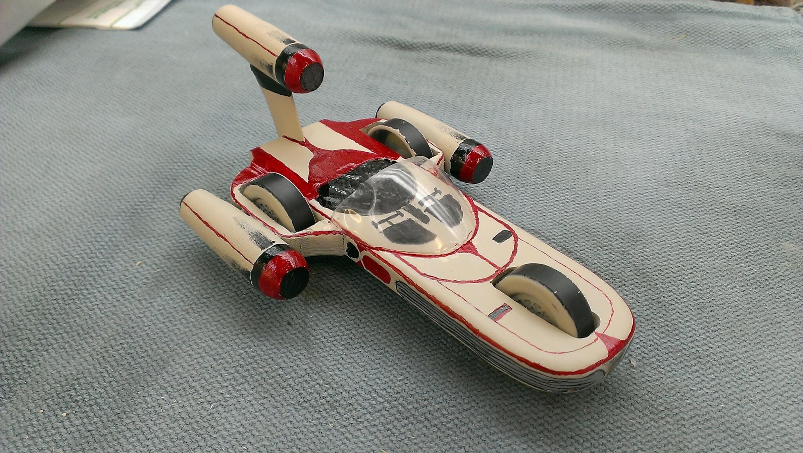 The coolest blog ever. Some pictures of the latest Pinewood derby car
