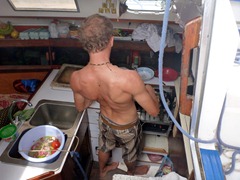 Our captain cooking up a storm in the rocking, swaying kitchen on the boat.