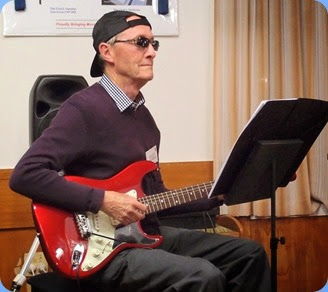 Brian 'Stevie Wonder' Gunson played us a virtuoso on his guitar and using an mp3 backing for his version of "Begin the Beguine". Photo courtesy of the Club's photographer, Dennis Lyons.