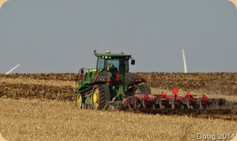 Farmer plowing his field