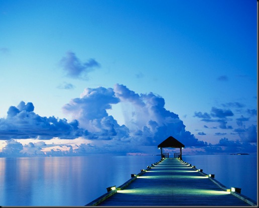 A dock at sunset on White Sands Island in the Maldives.