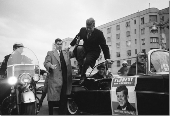 NEW YORK, UNITED STATES - SEPTEMBER 01, 1960: Predidential candidate John F. Kennedy leaping from his car while campaigning. (Photo by Paul Schutzer/Time & Life Pictures/Getty Images)