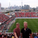 watching the match Toronto FC vs New England Revolution in Toronto, Canada 