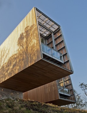 Architecture Project Two Hulls House fachada-de-casa-con-revestimiento-de-madera