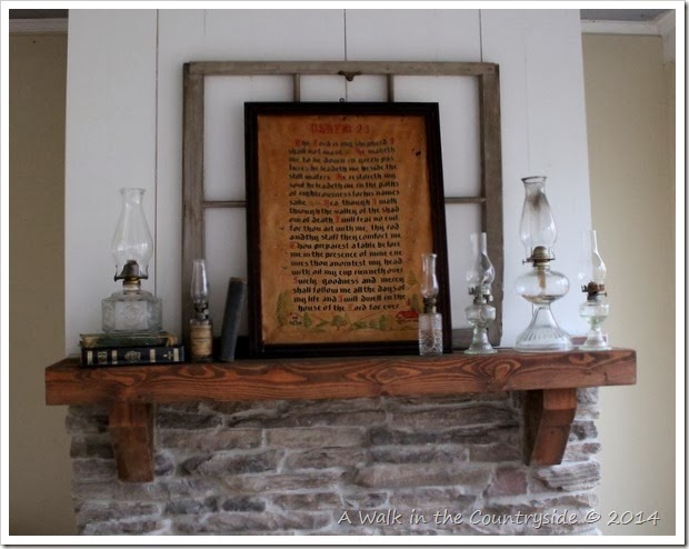 mantel decorated with religious items and oil lamps