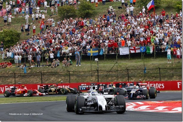 Hungaroring, Budapest, Hungary.
Sunday 27 July 2014.
Felipe Massa, Williams FW36 Mercedes, leads Jean-Eric Vergne, Toro Rosso STR9 Renault, and the remainder of the field at the start.
World Copyright: Alastair Staley/Williams F1.
ref: Digital Image _79P7184