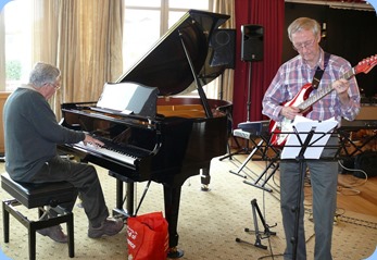 Jim Nicholson on grand piano and Brian Gunson on electric guitar. They were accompanying Len Hancy (vocals) and Peter Brophy (keyboard). Photo courtesy of Dennis Lyons.