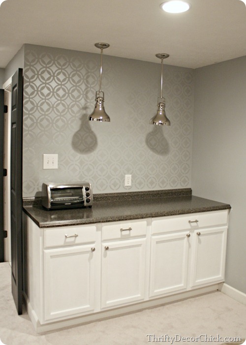 Basement kitchenette with stenciled wall