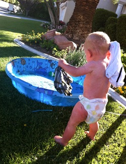 ryan throwing clothes in pool (1 of 1)