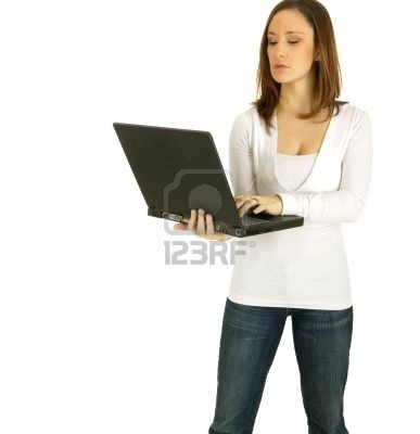 [2549378-caucasian-girl-act-as-a-computer-geek-holding-up-black-laptop%255B3%255D.jpg]