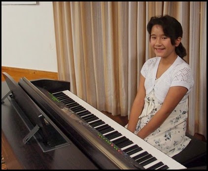 Hana Tani played our Clavinova CVP-509. Hana is a young lady of 9 years who has been playing for about 3 years and chose to play for us "Romanian Folk Dance" in six movements. Executed beautifully as well - amazing. Good luck with your upcoming competition Hana. Photo courtesy of Dennis Lyons.