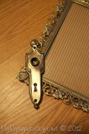 ornate frame and shiny antique door plate