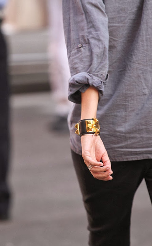 girl on the street casual outfit and gold pyramid studded black leather bracelet