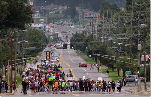 Marchers march up West Florissant Avenue, making a loop from the QuikTrip station to Highmont Road on Saturday, Aug. 16, 2014.  Photo by Robert Cohen, rcohen@post-dispatch.com