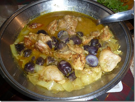 Purple congo potatoes halved and cooked in a chicken curry
