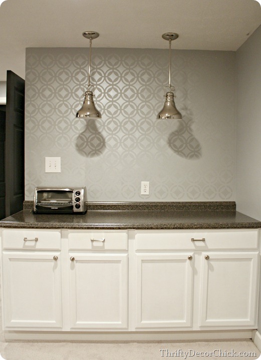 Stenciled wall in silver