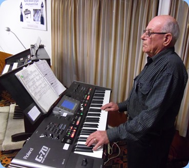 Laurie Conder playing the arrival music on his Roland G-70 music workstation