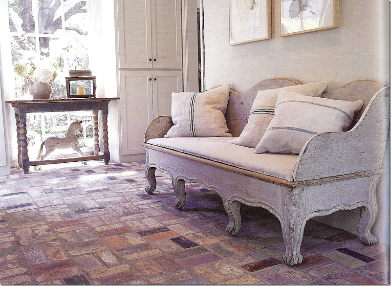 Swedish antiques and brick floor in a sun room by Jane Moore. Veranda, March 2008. #brickfloor #swedish #interiordesign #sunroom