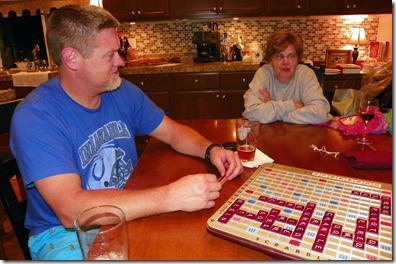 Regina Circeo and I watching  Tom and Ken play Scrabble.