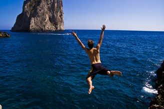 Flinging myself off a rock in Capri