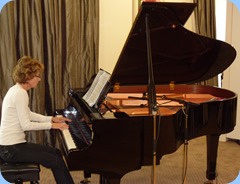 Denise Gunson playing the Yamaha Grand Piano very professionally
