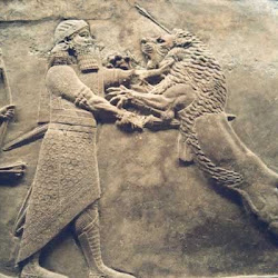 58 - Rey asirio luchando contra un leon en el palacio de Ninive