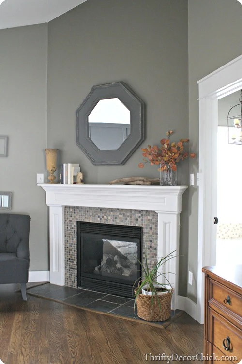 gray and green mosiac tile surround on fireplace