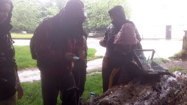 Earthworm Society of Britain (ESB) members huddle in the rain at Richmond Park