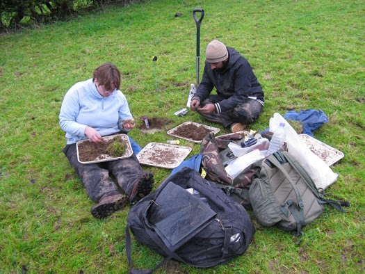 Natural History Museum Soil Biodiversity Group volunteers Irfaan and Victoria sorting soil for earthworms in Somerset