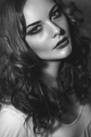 Sweet hot girl with black kohl around her eyes