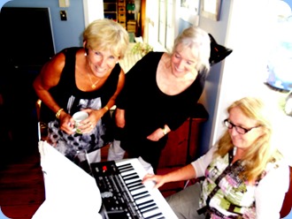 Jan Johnston and Delyse Whorwood taking a keen interest in Desiree Barrows playing using the Korg Pa3X