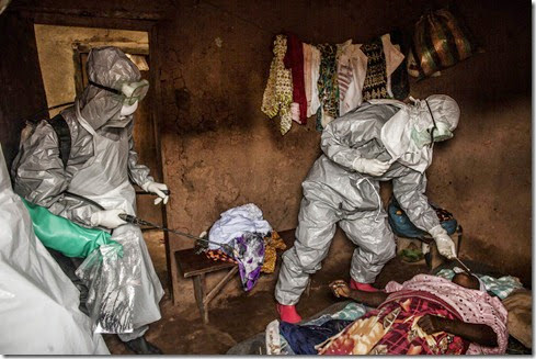 Members of a Red Cross burial team take samples from a   woman suspected of dying of Ebola in the village of Dia on Monday, August 18, 2014. So-called "safe burials," conducted by the International Federation of the Red Cross, are conducted in accordance with rigorous safety procedures. The dead bodies of Ebola victims are extremely infectious.(Pete Muller/Prime for the Washington Post) 