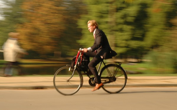 Amsterdam businessman commuting by bike