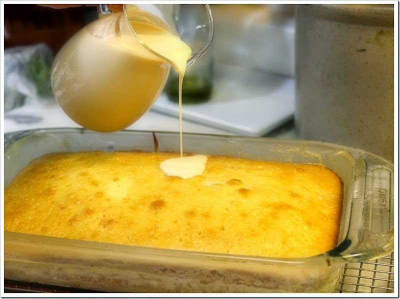 A combination of three kinds of milk getting poured on cake. 
