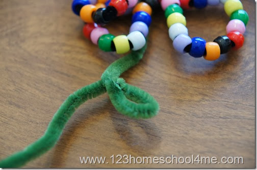 add green pipe cleaner for stem and leaf add green pipe cleaner for stem and leaf