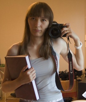 Me and my bloodsucking diploma "in print". And yes, that is some scuba stuff stashed in a box behind me.